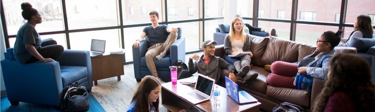 Students relaxing in lounge of Living Learning Communities